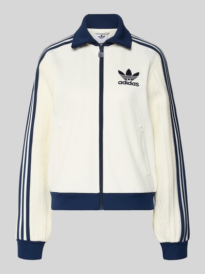Produktfoto, Strickjacke mit Reißverschluss von adidas Originals in Creme mit dunkelblauen Details, Baumwoll-Mix, lockerer Schnitt, Stehkragen, Label-Stitching, gerippte Abschlüsse und Reißverschlusstaschen