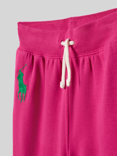 Produktfoto, Regular Fit Sweathose aus Baumwoll-Mix von Polo Ralph Lauren Teens in Pink, unifarben, grünes Logo-Stitching, elastischer Bund mit Tunnelzug, Sweat-Textur, seitliche Eingrifftaschen, Mid Waist.