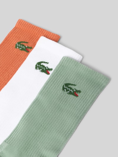 Produktfoto, Socken aus Baumwoll-Mix im 3er-Pack von Lacoste in Grün, Weiß und Orange mit gesticktem Logo, Herren Socken von Lacoste