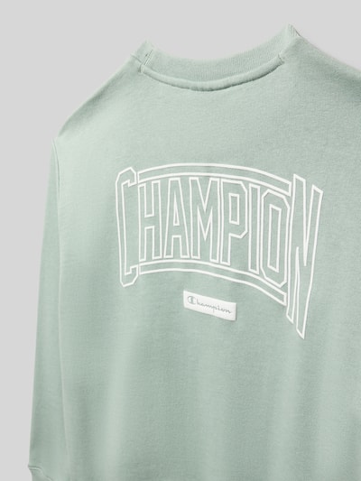 Produktfoto, Regular Fit Poloshirt mit V-Ausschnitt von CHAMPION im Baumwoll-Mix, mintgrün, große weiße Logoprägung, glatte Textur
