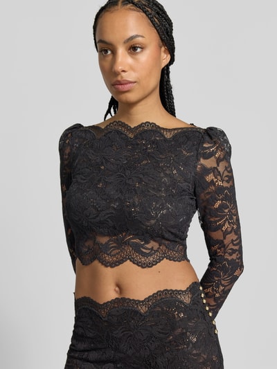 Kobiece modelka nosi Cropped Langarmbluse aus Spitze od Rabanne, elastyczna mieszanka materiałów, krój krótki, koronka, półprzezroczysty materiał, dopasowany krój, kolor czarny, widoczne koronkowe zdobienia, Długość tyłu w rozmiarze 38: 40 cm, Długość rękawów w rozmiarze 38: 68 cm, półzbliżenie na górną część ciała