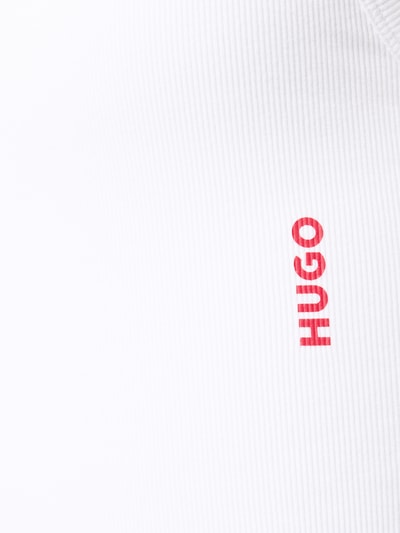 Produktfoto, weißes Tanktop mit Label-Print im 2er-Pack von HUGO aus Baumwoll-Elasthan-Mix in Ripp-Optik, breite Träger, körpernahe Passform