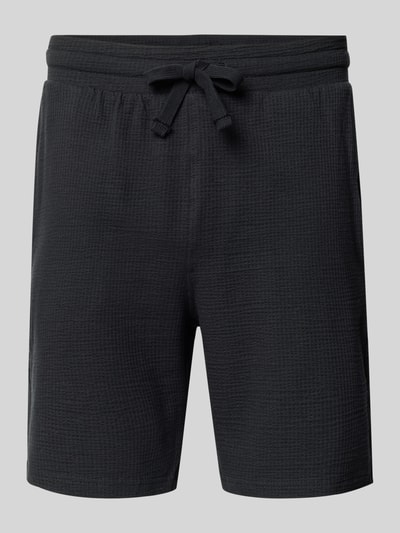 Produktfoto, Loose Fit Sweatshorts aus Bio-Baumwoll-Mix Modell 'KIAN' von Only & Sons, Optik: Unifarben, Piqué-Textur, Label-Patch, elastischer Bundabschluss mit Tunnelzug, seitliche Eingrifftaschen, angedeutete Paspeltaschen, Materialverarbeitung: Bio-Baumwoll-Mix, dunkel gehalten.