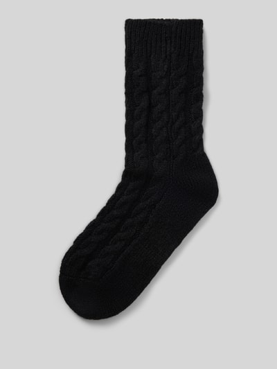 Produktfoto, schwarze Socken mit Zopfmuster, elastisches Rippbündchen, Label-Detail, Socken mit Zopfmuster Modell 'Cosy' von camano, Damen Socken
