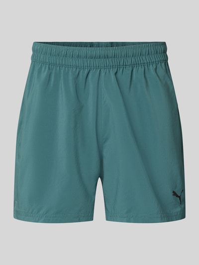 Produktfoto, Regular Fit Sportshorts mit Logo-Print Modell 'TAD ESSENTIALS' von PUMA in Türkis mit elastischem Bund, glatter Stoff, Herren Sportshorts von PUMA Performance