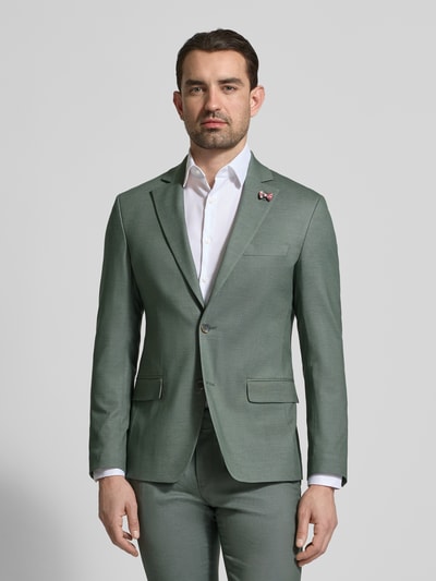 Männermodel trägt Slim Fit 2-Knopf-Sakko mit Pattentaschen von ATELIER TORINO in grünem Material-Mix mit Viskose, Ganzkörperansicht von vorne.