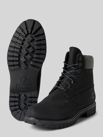Produktfoto, Boots aus echtem Leder mit Logo-Detail von Timberland in Schwarz, abgerundete Passform, profilierte Sohle, Schnürverschluss, Damenmodell, Absatzhöhe 4 cm, Schafthöhe 15 cm, Schaftweite 10 cm