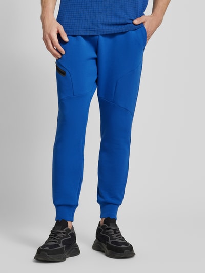 Under Armour Regular fit sweatpants met ritszak, model 'UNSTOPPABLE' Rookblauw - 4