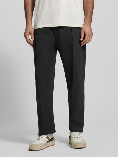 Męski model nosi Relaxed Fit Sweatpants aus Baumwoll-Mix Modell 'SE_TWIST' von BOSS Orange, melanż, naszywka z logo, zakładka w pasie, krój relaxed fit, kieszenie z zamkiem i wpuszczane, elastyczny pas z tunelem, dzianina dresowa, mieszanka bawełny, całkowity widok z przodu