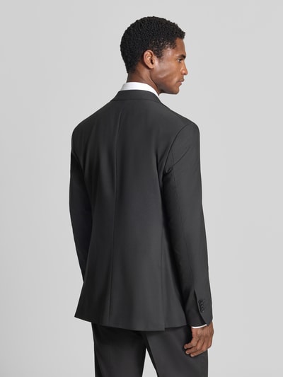 Männermodel trägt Regular Fit Sakko mit Schurwoll-Anteil Modell 'Totti' von CINQUE in Schwarz, strukturierte Oberfläche, Ganzkörperansicht Rückansicht.