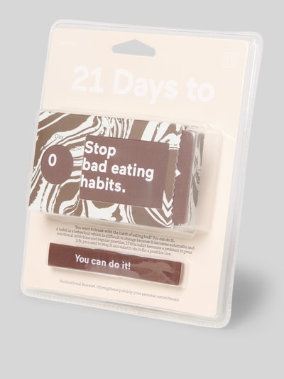 Produktfoto, Ticketbox mit Motivationsarmband von Doiy, 21-Tage Challenge Modell '21 Challenge Eating', brązowe i białe kolory, abstrakcyjne wzory, wyraźna tekstura kartonu.