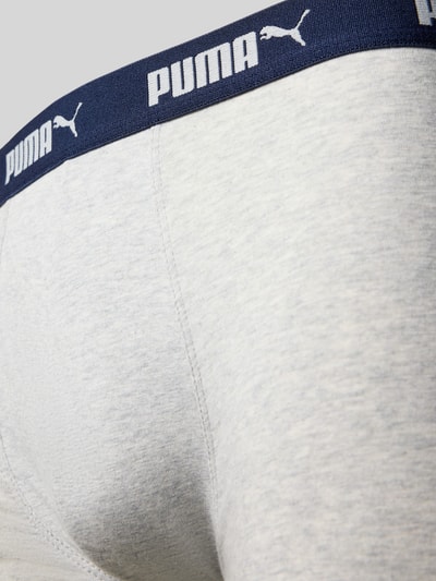 Produktfoto, Trunks im 4er-Pack mit elastischem Logo-Bund von PUMA aus Baumwoll-Mix mit Stretch, meliertes Hellgrau, blauer Bund, körpernah