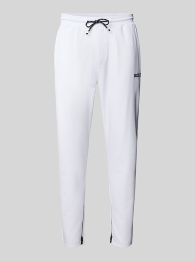 Produktfoto, Regular Fit Sweatpants mit Label-Stitching Modell 'JT_TOC SPIN LONG' von BOSS Green, Optik: Unifarben, Kontraststreifen, Tunnelzug, seitliche Eingrifftaschen, Gesäßtasche, Bundabschluss: elastisch, Materialverarbeitung: Sweat, Farbe Weiß