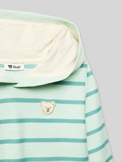 Productfoto, Hoodie aus reiner Baumwolle van Steiff voor kinderen, los model, capuchon, motiefapplicatie, elastische boorden, lichtgroene en turquoise strepen, zachte textuur