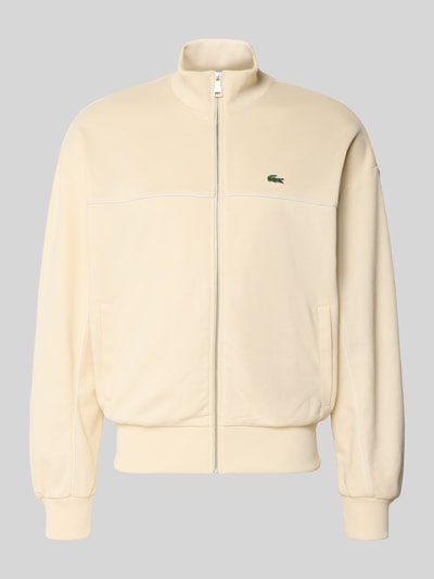 Produktfoto, Regular Fit Sweatjacke mit Baumwoll-Anteil von Lacoste w kolorze kremowym, jednolita, z logo, pasy kontrastowe, krój regular fit, zamek, kieszenie boczne, materiał mieszany
