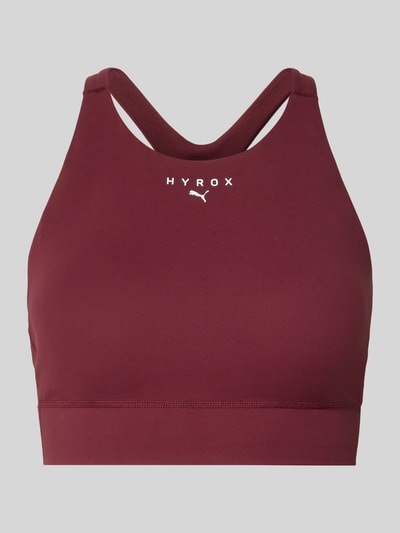Productfoto, 'PUMA x HYROX - BH mit Label-Print' van PUMA, bordeauxrood, stretchstof, ronde hals, elastische band, nauwsluitende pasvorm