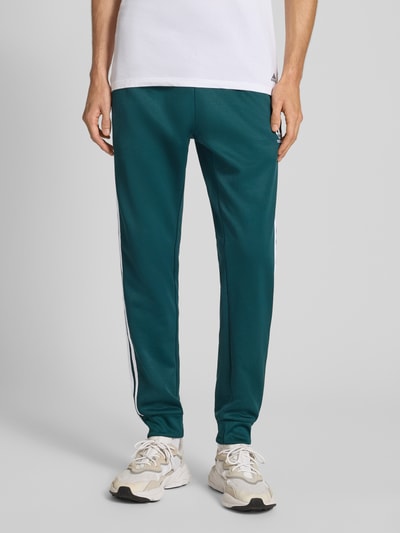 adidas Originals Spodnie dresowe o kroju slim fit z wyhaftowanym logo Ciemnozielony 4