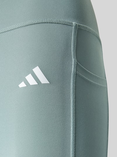 Productfoto, Leggings met logo en elastische tailleband van adidas Sportswear, blauwgroen, rekbare materiaalmix, nauwsluitende pasvorm.