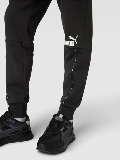 PUMA PERFORMANCE Sweatpants mit Label-Print Modell 'ESS BLOCK x TAPE' Black 3