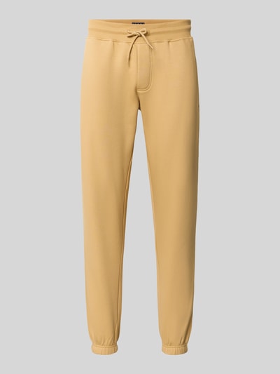 Productfoto, Slim Fit Sweathose uit katoenmix van Tommy Jeans in effen lichtgeel met zachte, gladde textuur, Heren Sweathose