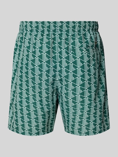 Produktfoto, Badehose mit Logo-Muster von Lacoste in Grün mit Optik: Allover-Muster und Logo-Stitching, Tunnelzug, elastischer Bundabschluss, Funktion: schnelltrocknend, seitliche Eingrifftaschen, Gesäßtasche, besondere Merkmale: mit Trockenbeutel.