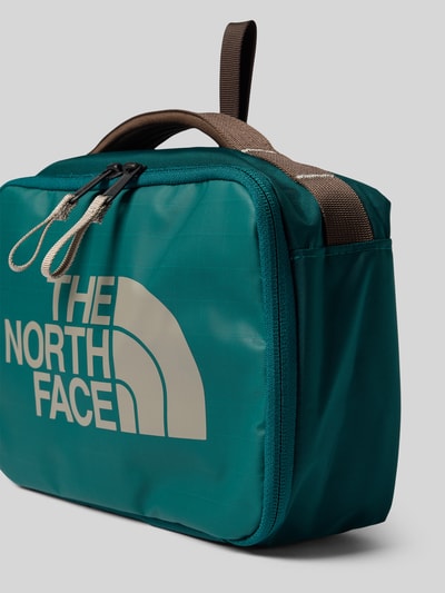 Produktfoto, Kulturbeutel mit Logo-Print Modell 'Voyager' von The North Face in Türkis mit beigem Logo, Reißverschluss, Trageriemen, glatte Textur