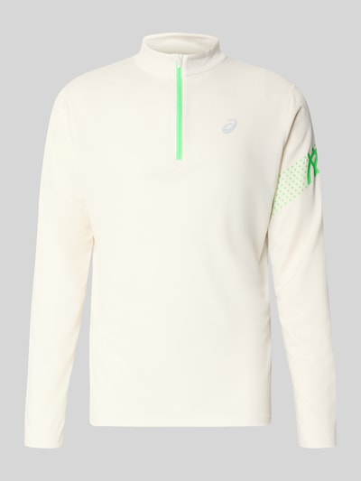 Produktfoto, Langarmshirt mit Troyer-Kragen Modell 'ICON' von ASICS TIGER in Beige mit grünem Reißverschluss, Label-Print, glatte Textur.