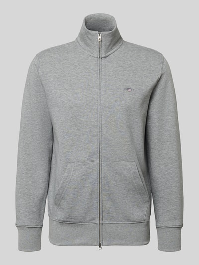 Produktfoto, graue Regular Fit Sweatjacke mit Stehkragen Modell 'Gield' von Gant, Baumwoll-Mix, Logo-Stitching, Reißverschluss, Kängurutasche, elastische Abschlüsse.