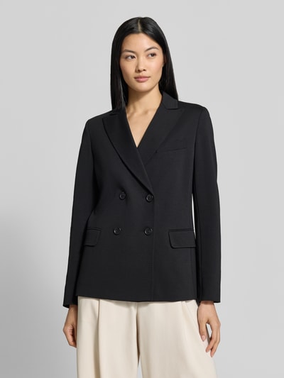 Frauenmodel trägt Regular Fit Longblazer mit doppelter Knopfleiste Modell 'WKDCOLIBRI' von Max Mara in Schwarz, glatte Struktur, Ganzkörperansicht von vorne.