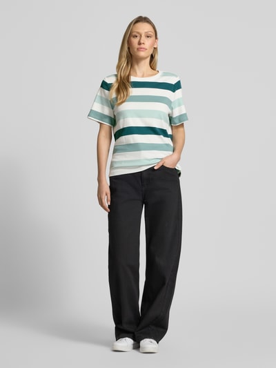 Vrouwenmodel draagt Relaxed Fit T-Shirt uit pure katoen van Tom Tailor, effen look, motiefprint, ronde hals, korte mouw, volledige lichaamsvoorzijde.
