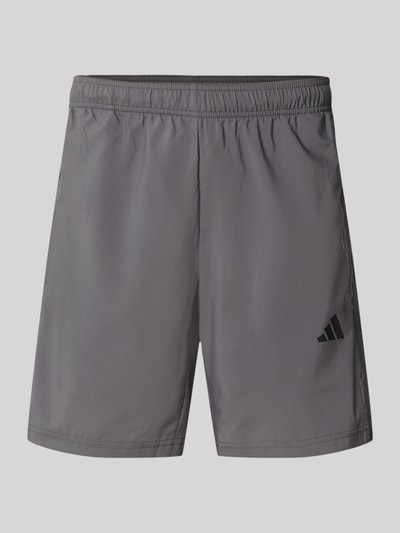 Produktfoto, szare szorty o prostym kroju regular fit z nadrukiem z logo, delikatna gładka tekstura, Regular Fit Sportshorts mit Logo-Print Modell 'WE BAS 3SWV SH' von adidas Training