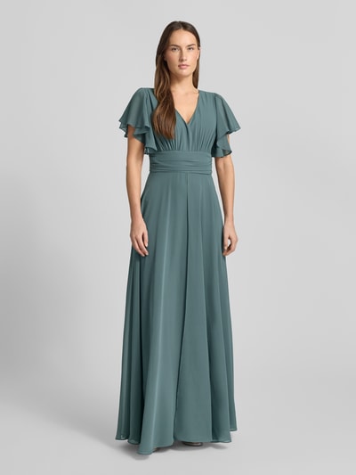 Frauenmodel trägt Jumpsuit mit V-Ausschnitt von Swing in Petrol mit tailliertem Schnitt, Material-Mix, Raffungen, Ganzkörperansicht von vorne.