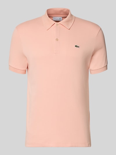 Produktfoto, Regular Fit Poloshirt aus reiner Baumwolle von Lacoste in Optik: Unifarben, Logo-Detail, Polokragen, Kurzarm, Rumpfabschluss asymmetrisch