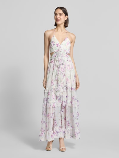 Frauenmodel trägt Regular Fit Midikleid mit Rüschenbesatz von ADLYSH mit floraler Allover-Print, V-Ausschnitt, Halterneck, Rückenausschnitt, Falten-Optik, fließende Stoffstruktur, sanfte Pastellfarben, Rückenlänge bei Größe S: 126 cm, Brustweite bei Größe S: 30 cm, Ganzkörperansicht von vorne.