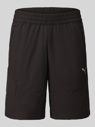 Produktfoto, schwarze Regular Fit Sportshorts mit Label-Print von PUMA, glatte Textur, elastischer Bund, Herren Sweatshorts von PUMA Performance