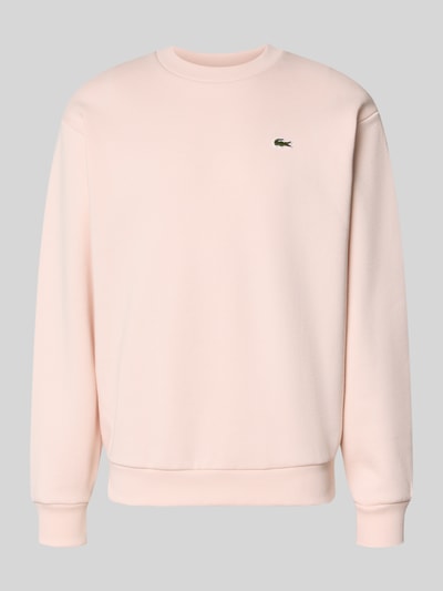 Produktfoto, Regular Fit Sweatshirt aus Baumwoll-Mix von Lacoste in Hellrosa mit glatter Textur und kleinem Markenlogo auf der Brust, Herren Sweatshirt von Lacoste