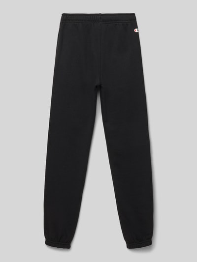 Produktfoto, schwarze Regular Fit Sweatpants aus Baumwoll-Mix mit elastischem Bund, Seitentaschen und Label-Detail von CHAMPION