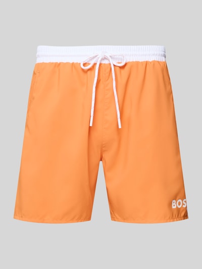 Produktfoto, Badehose mit Paspelnaht in Kontrastfarbe Modell STARFISH von BOSS in Orange mit weißem Bund und Label-Schriftzug, Popeline