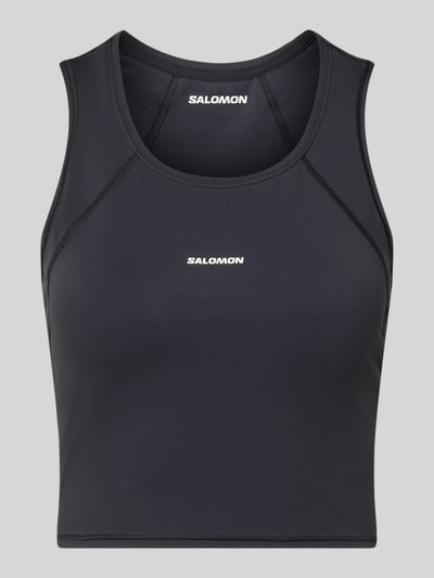 Produktfoto, Cropped Tanktop mit Logo von Salomon in Schwarz, Rundhalsausschnitt, Materialmix mit Stretch, schlichtes Design, Damen Tanktop