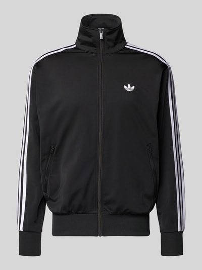 Produktfoto, Sweatjacke mit Reißverschluss von adidas Originals in Schwarz mit weißen Streifen, Regular Fit, Stehkragen, Label-Stitching.