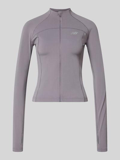 Produktfoto, Funktionsjacke mit Logo Modell 'HARMONY' von New Balance in Flieder, schlanker Schnitt, Material-Mix mit Stretch, sichtbarer Reißverschluss.