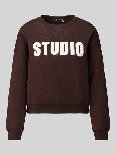 Produktfoto, ciemnobrązowa bluza Loose Fit Sweatshirt aus Baumwoll-Mix model 'SWEAT' von ONLY, napis STUDIO, faktura gładka, sweter damski
