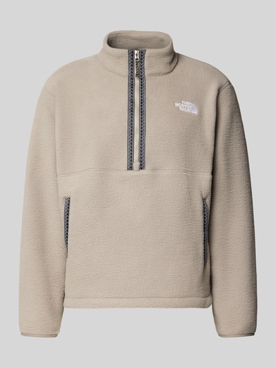 Produktfoto, Fleecepullover mit Stehkragen und Reißverschluss von The North Face, beige, Label-Stitching, Regular Fit, weiche Textur
