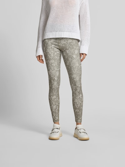 Frauenmodel trägt Leggins mit Allover-Paisley-Print von Juvia im Slim-Fit aus Elastischer-Material-Mix, Knöchellänge, breiter Bund, Ganzkörperansicht von vorne.