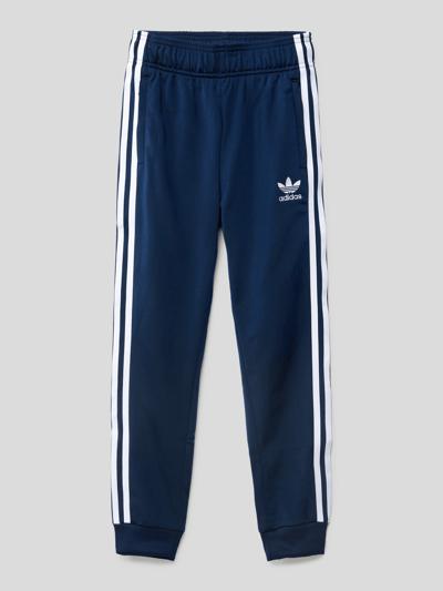 Adidas originals superstar cuffed track pants navy/red best sale