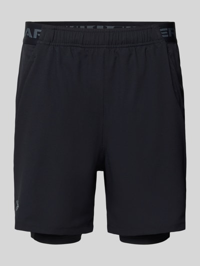 Produktfoto, schwarze Regular Fit Shorts mit integrierten Tights Modell 'Vanish' von Under Armour, elastischer Bund, Logo-Print, Eingrifftaschen, texturierte Oberfläche