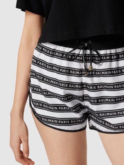 Balmain Shorts mit Allover-Label-Print Schwarz 3