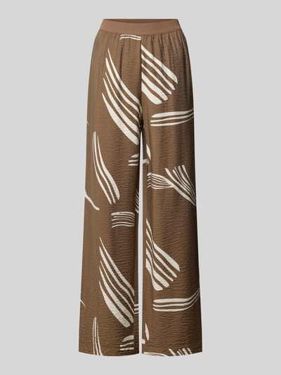 Produktfoto, Stoffhose aus Viskose-Mix Modell 'Cevil leaf' von someday, brązowy kolor, wzór allover, elastyczny pas, relaxed fit, szerokość w rozmiarze 36: 38 cm, długość nogawki wewnętrznej w rozmiarze 36: 79 cm, tekstura lekko marszczona