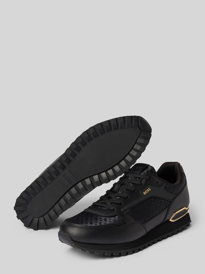 Produktfoto, schwarzer Sneaker aus echtem Leder-Mix Modell 'PARKOUR-L_RUNN_NMNAL' von BOSS mit goldenen Details, Herren Sneaker