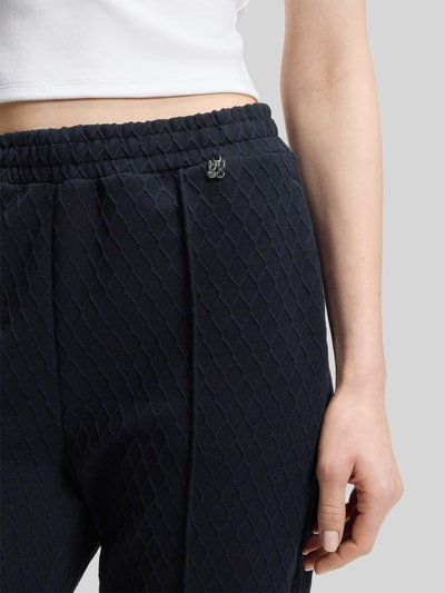 HUGO Spodnie o kroju relaxed fit o szerokim fasonie z detalem z logo model 'NADID' Granatowy 3